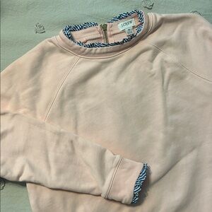 J. Crew light pink pullover with blue striped trim
